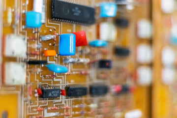 Electric control panel. Circuit boards with microchips and resistors. Close-up.