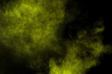 Light green powder explosion on black background. Colored powder cloud. Colorful dust explode. Paint  Holi.