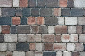 masonry wall paving stones as a background close up