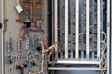 Chip boards and electronic components. Control cabinet, view from the inside. Close-up.