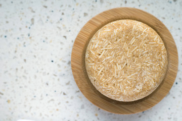 Top view soap on a bamboo stand.
