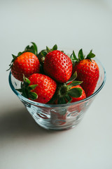 Strawberries in a glass bowl.