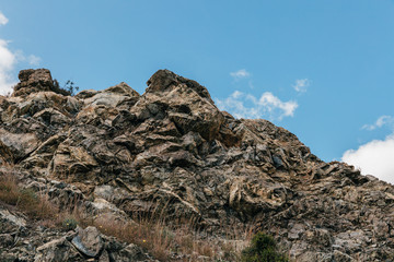 Large stone boulders in mountains with blue sky, in Cyprus