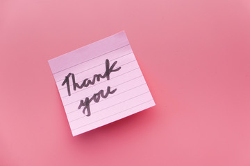 Close up of thank you message on pink.