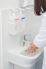 Obraz na płótnie Canvas hand washing and sanitizer disinfection. The doctor is preparing to receive patients
