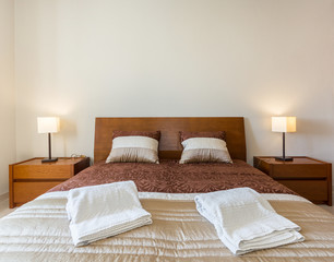 Fototapeta na wymiar Modern bedroom. European hotel design.