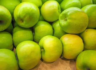 background of green apples on sale