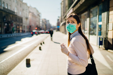 Anxious young adult affected by the COVID-19.Walking,going to work during pandemic.Protective measures,mask wearing and social distancing.Respecting guidelines.Avoiding contact.Fear of coronavirus