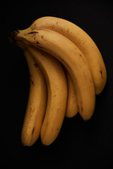 Bunch of bananas on a black background