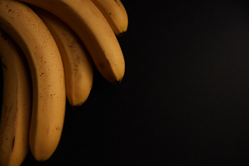 Bunch of bananas on a black background
