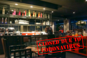 Defocused view of interior of an upmarket restaurant, empty and closed due to coronavirus or covid 19
