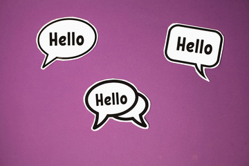 three white clouds with the inscription hello on a purple background.