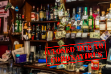 Naklejka na ściany i meble Defocused, blurred view of interior of traditional bar or pub, empty and closed due to coronavirus or covid 19 pandemics