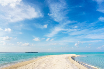 View of the beach of an unnamed coral island. Maldives.