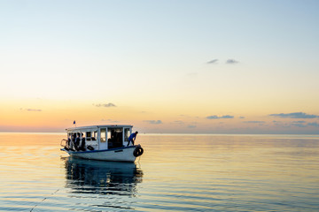 Diving boat at sunset. Maldives.