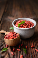 Healthy snack rich in antioxidants and vitamins for boosting immunity, dried Goji berry in a bowl and scoop