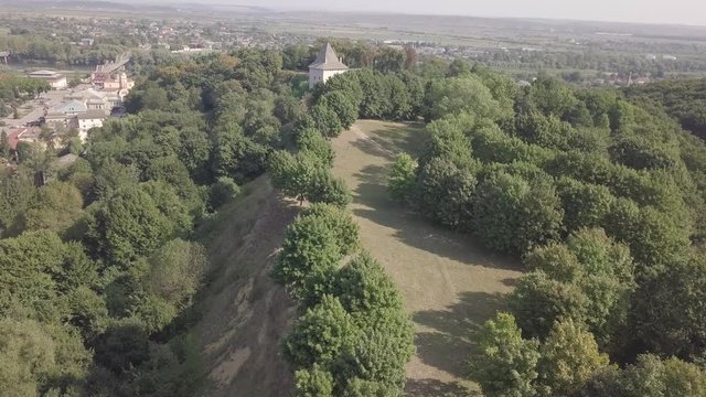 Aerial view of ruined medieval Halych Castle on the hill at sunny day, Halych, Ivano-Frankivsk region, Ukraine