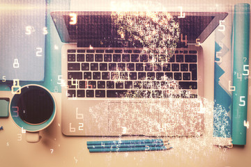 Technology hologram drawing over computer on the desktop background. Top view. Double exposure....