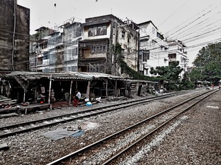 Train track in Bangkok and some wood cabins next to it hdr