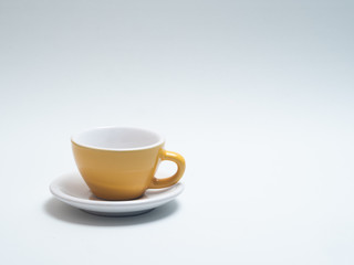 yellow coffee cup on a white background