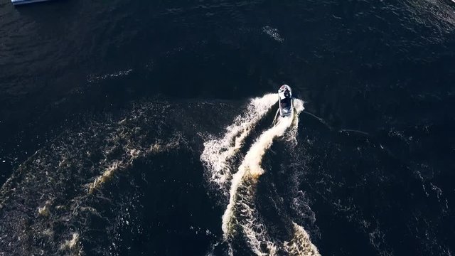 Aerial view of Jet Ski Doing Spins at Dusk