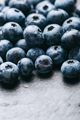 Fresh blueberry background. Texture blueberry berries close up. Vegan and vegetarian concept.