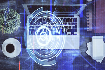 Multi exposure of data theme drawing hologram over topview work desk background with computer. Concept of technology.