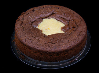 Chocolate volcano cake on black background