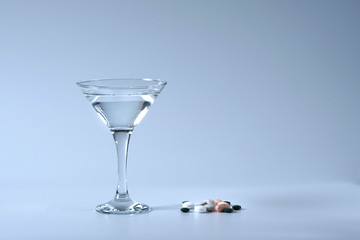 Summer coctail. Glass of water and medicin.
