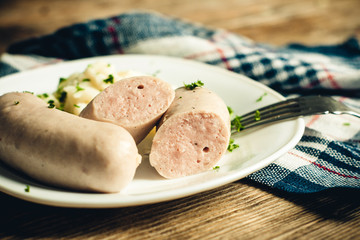 sausages and mashed potatoes on a plate close-up