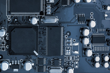 Electronic circuit board close up. toned