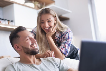 close up. young couple looking at laptop screen.