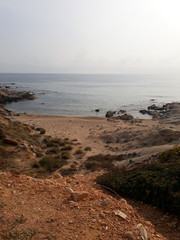 Beautiful stony coast in Naxos at sunset light