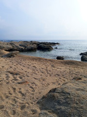 Beautiful stony coast in Naxos at sunset light