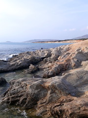 Beautiful stony coast in Naxos at sunset light