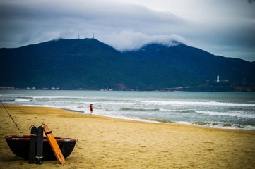 Boat on sandy shore of an Asian warm beach by the sea