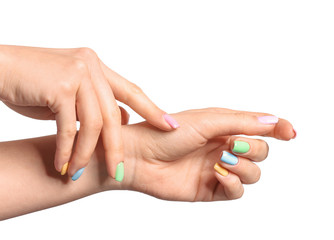 Hands of young woman with beautiful manicure on white background