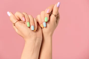 Foto op Plexiglas Manicure Hands of young woman with beautiful manicure on color background