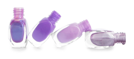 Different nail polishes on white background