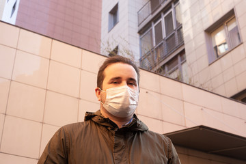 A man in a protective mask against coronavirus. Coronavirus man mask