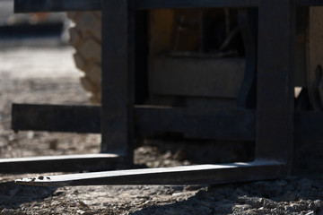 forklift tines close-up on a construction site