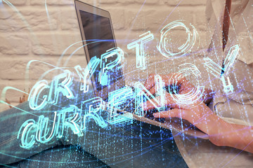 Double exposure of woman hands typing on computer and crypto market theme hologram drawing....