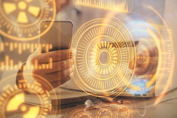 Double exposure of man hands holding a credit card and tech theme drawing. Technology in E-commerce concept.