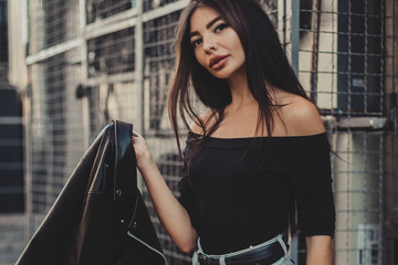 Pretty young sexy fashion woman posing on  ventilators background.