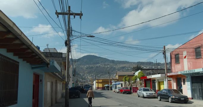 Xela Quetzaltenango Downtown streetview with older gentleman walking by