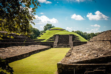 Tajin pyramids in Mexico, niches area picture on a sunny day, grass is covering this area of the...