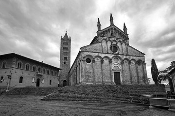 historic stone church with a belfry in the city of Massa Maritima in Tuscany.