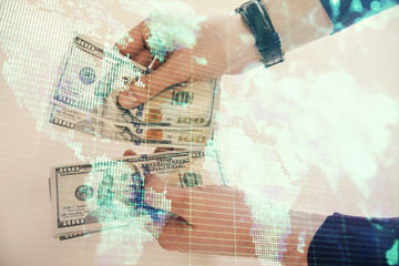 Multi exposure of financial theme drawing hologram and USA dollars bills and man hands. Business concept.