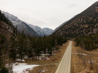 Aerial Panoramic View of a Scenic Road in the Canadian Mountain Landscape during a cloudy springtime. Taken between Pemberton and Lillooet, BC, Canada.