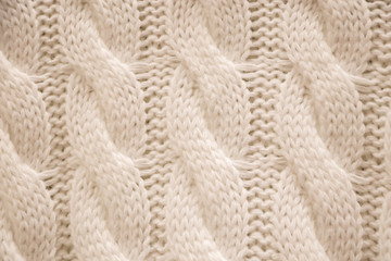 The texture of a knitted sweater. Knitting, home accessories.